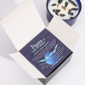 Interior del packaging de la vela energética del zodiaco Piscis con pulsera incluida.