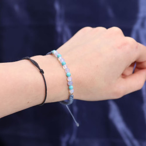 Pulsera de piedras preciosas en tonos azules y verdes incluida con la vela energética Piscis.