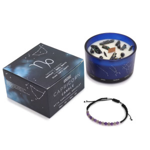 Vela energética del zodiaco Capricornio con envase de vidrio azul, caja ilustrada y pulsera de piedras preciosas.