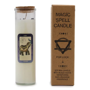 Vela ritual de suerte en envase de vidrio con cera de soja y minerales naturales para uso espiritual consciente.