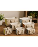 Cesta ecológica de yute y algodón con asas para organización y decoración natural.