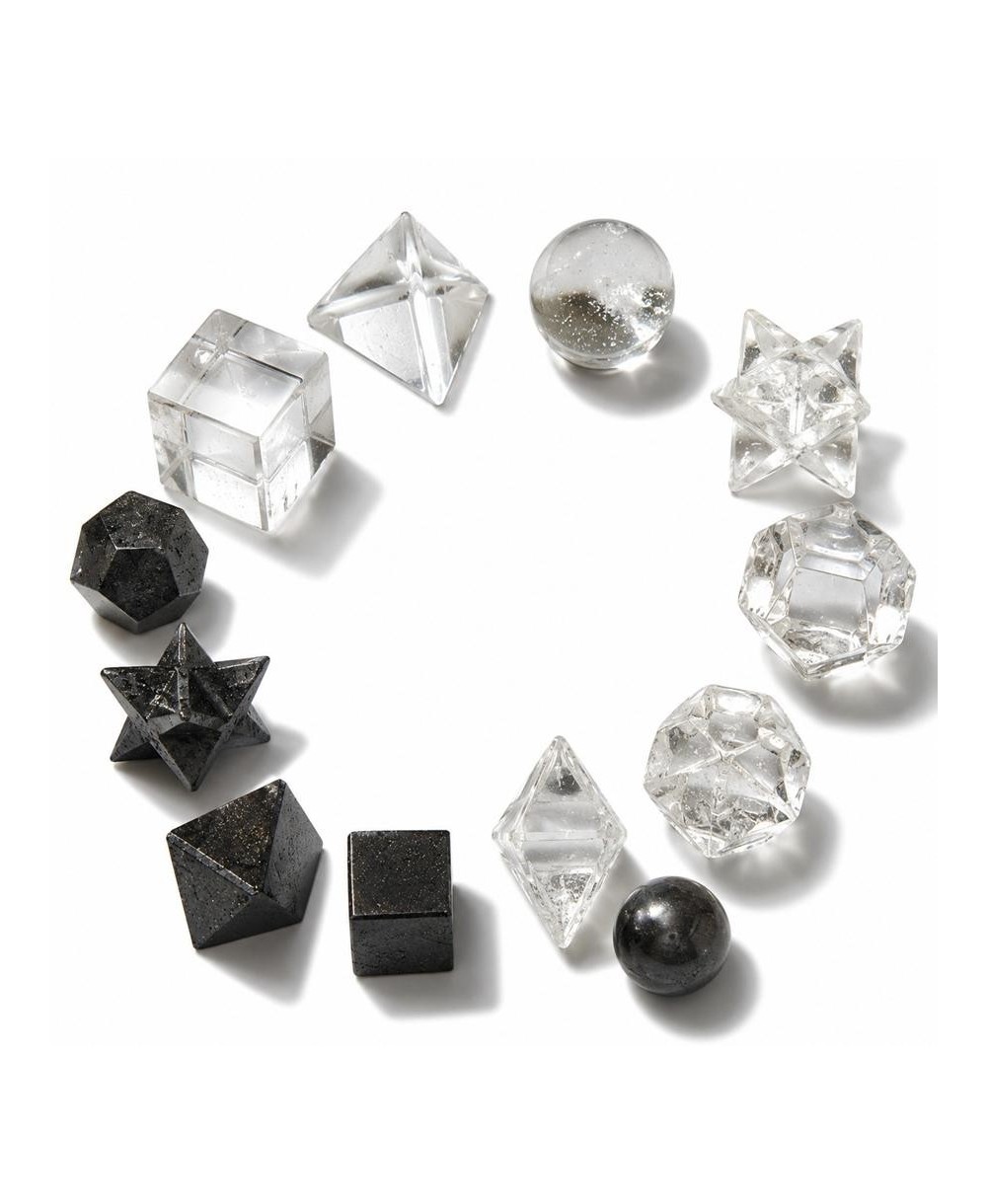 Set de siete figuras geométricas talladas en piedra natural para meditación y decoración espiritual.
