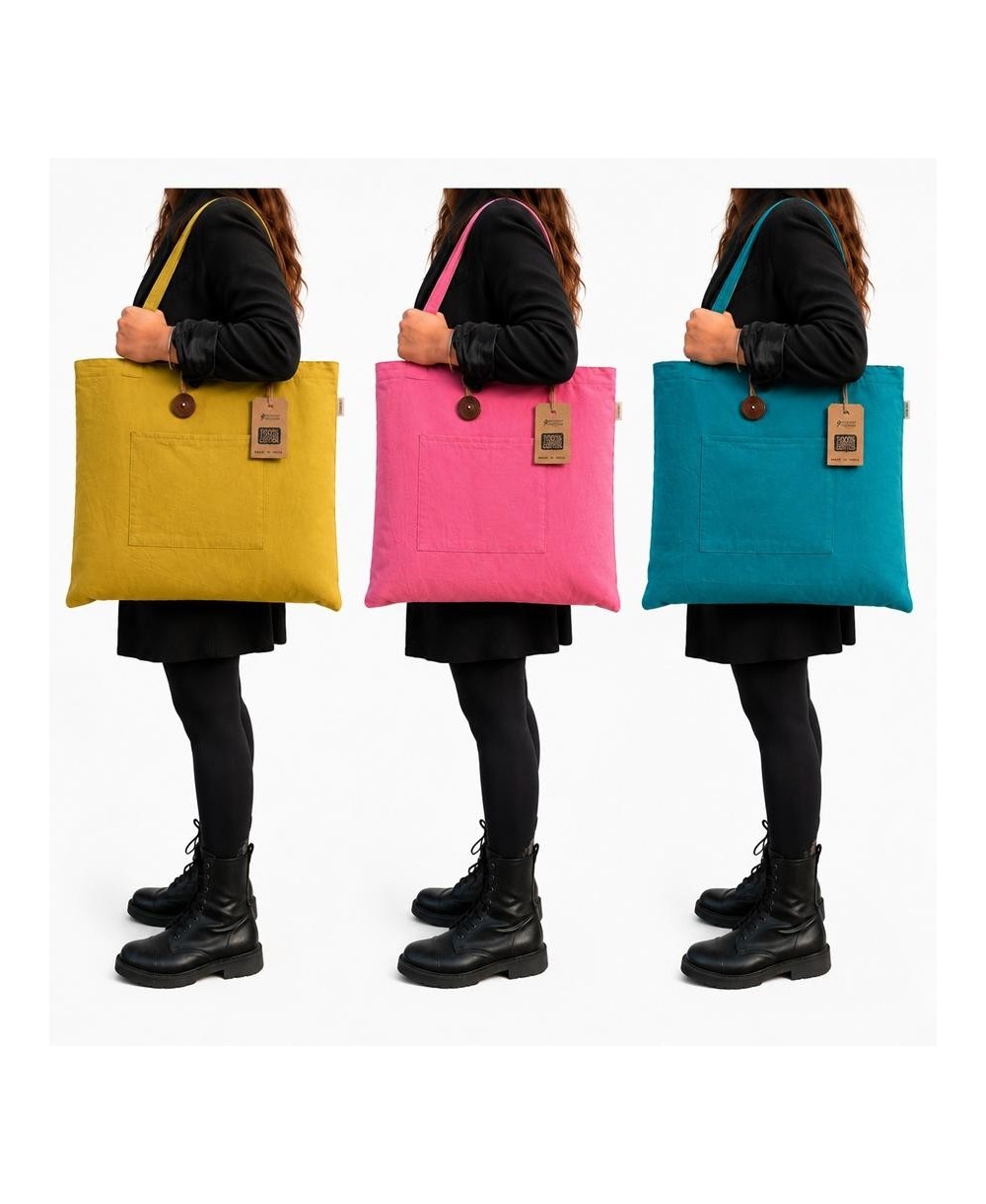 Bolsos grandes reversibles disponibles en varios colores y con bolsillo exterior y asas largas.