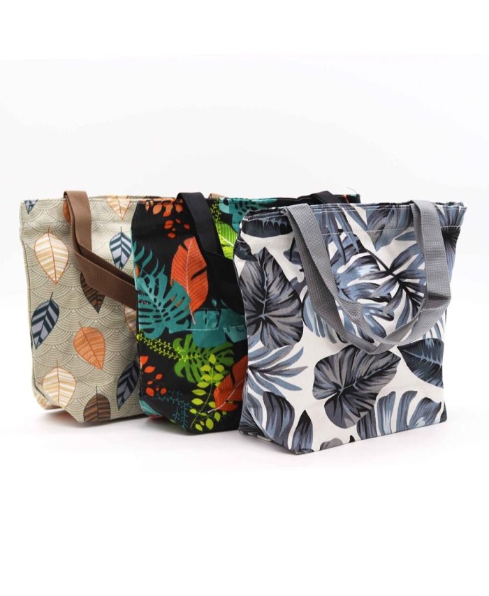 Bolsas tropicales reutilizables con estampados de hojas para compras y uso cotidiano.