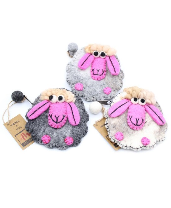 Monederos artesanales de ovejita enviados aleatoriamente según disponibilidad de stock.