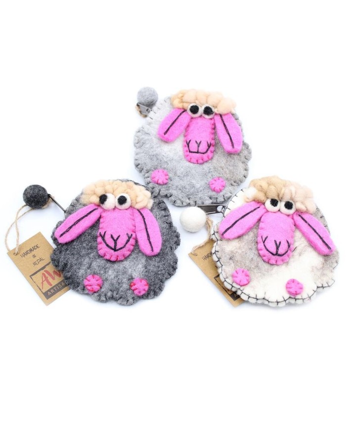 Monederos artesanales de ovejita enviados aleatoriamente según disponibilidad de stock.