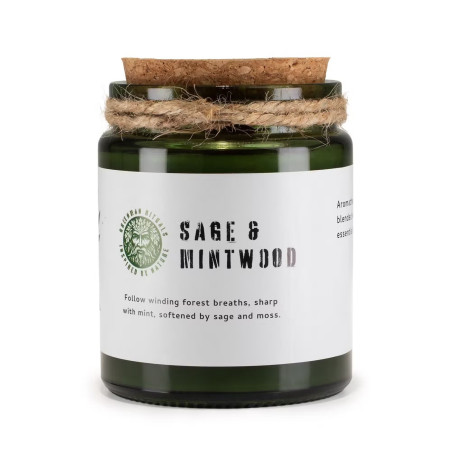 Vela de soja aroma salvia y menta en frasco de vidrio verde con tapa de corcho.