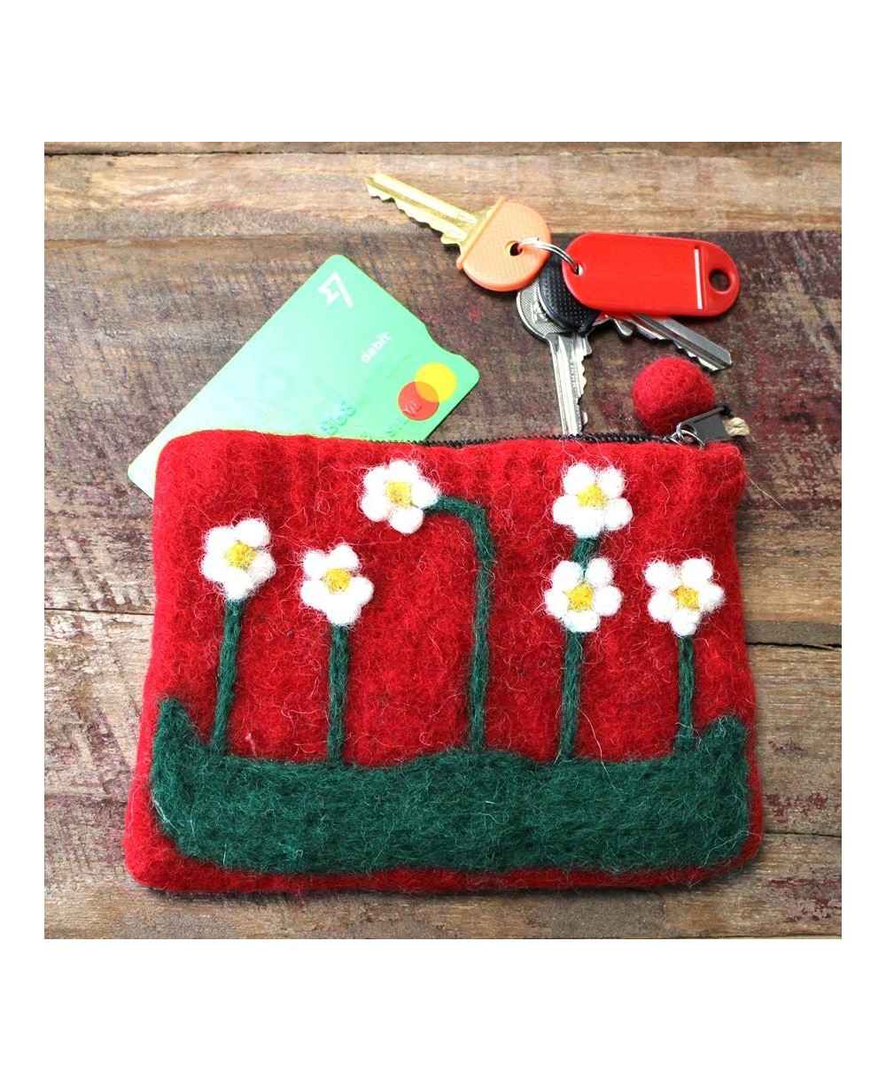 Monedero artesanal de lana afieltrada con flores decorativas hecho en Nepal.