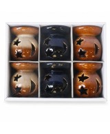 Quemadores de aceite de cerámica con diseño de sol y estrella en colores surtidos para aceites esenciales y ceras aromáticas.