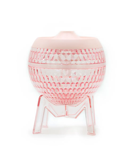 Difusor de aromas USB rosa con diseño transparente y luz LED para aceites esenciales.
