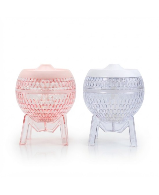 Difusor de aromas USB rosa con diseño transparente y luz LED para aceites esenciales.