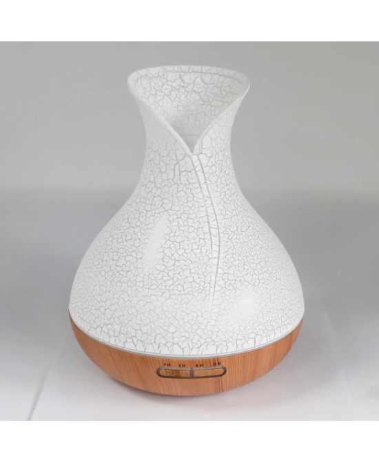 Difusor de aromas Palma USB con acabado efecto concha y base efecto madera.