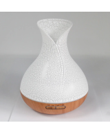 Difusor de aromas Palma USB con acabado efecto concha y base efecto madera.
