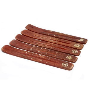 Portainciensos decorativo para varillas con incrustaciones doradas.