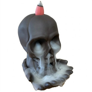 Quemador de incienso de cerámica con forma de calavera para conos de flujo inverso.