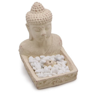 Portaincienso con figura de buda y base con piedras para conos o varillas.