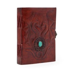 Vista frontal del diario artesanal en color marrón rojizo, grabado con dos dragones y una turquesa central.